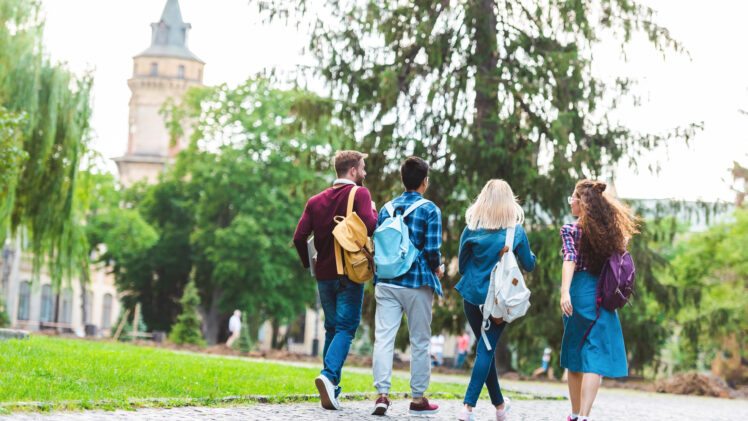 students walking outside at a university