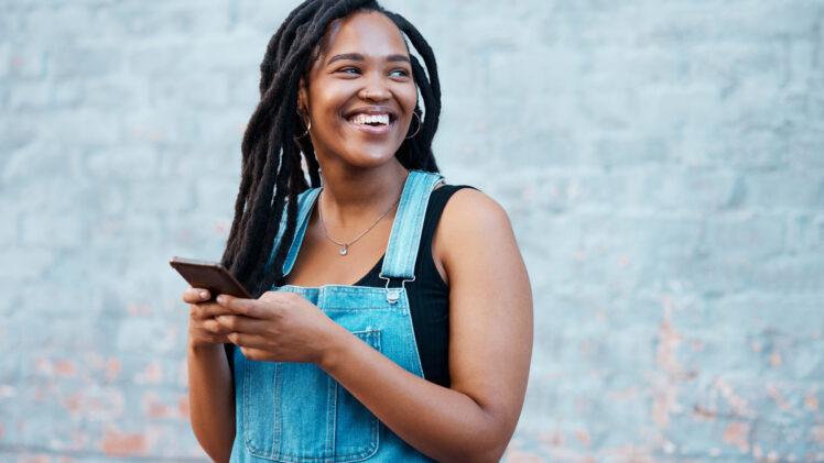 photo of college student looking at her phone