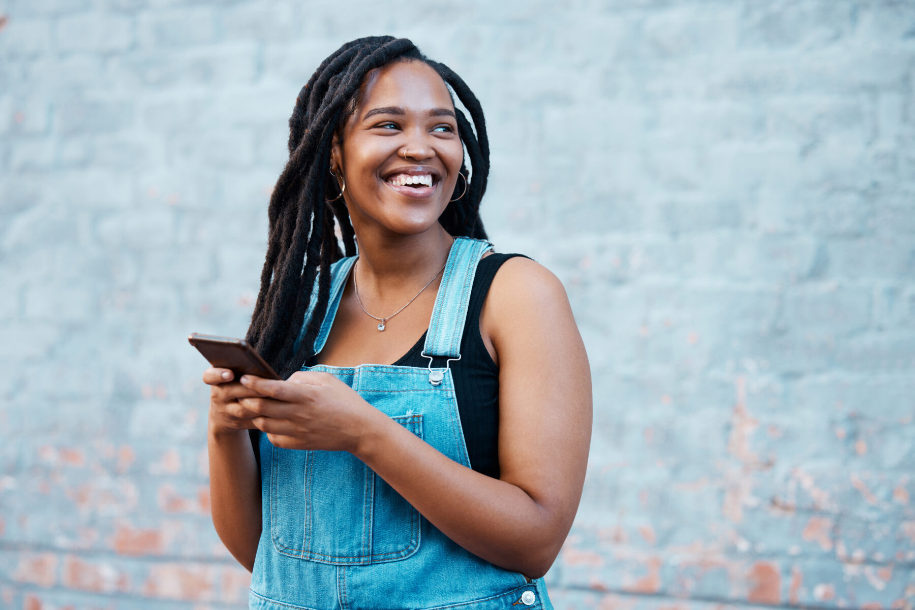 photo of college student looking at her phone